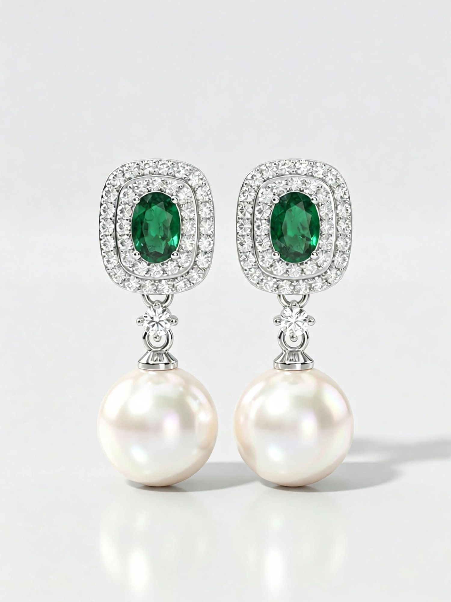 Angled overhead shot luxury green dream pearl drop earrings studio shot