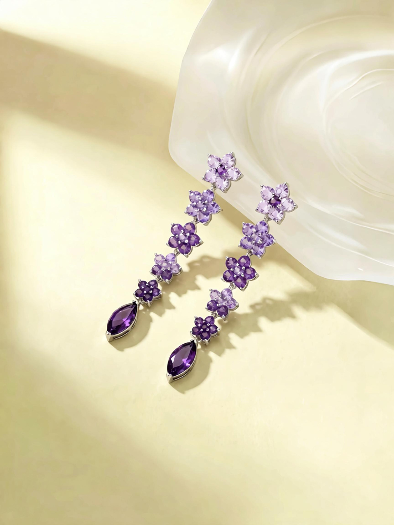 Close‑up shot wisteria glimmer floral dangle earrings cascading purple flower zircon details