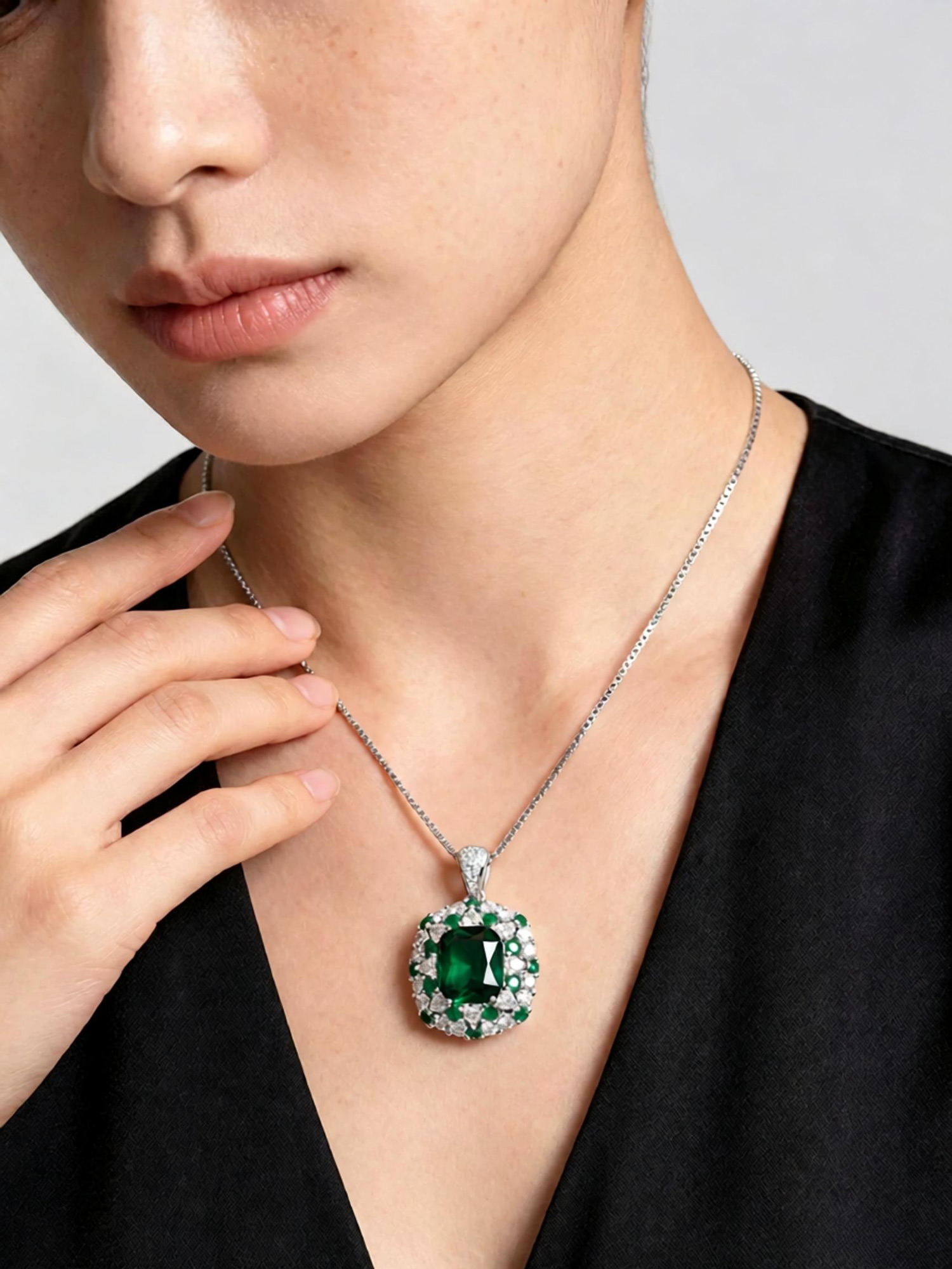 Emerald journey pendant necklace worn on neck, 45cm box chain with platinum k‑gold finish