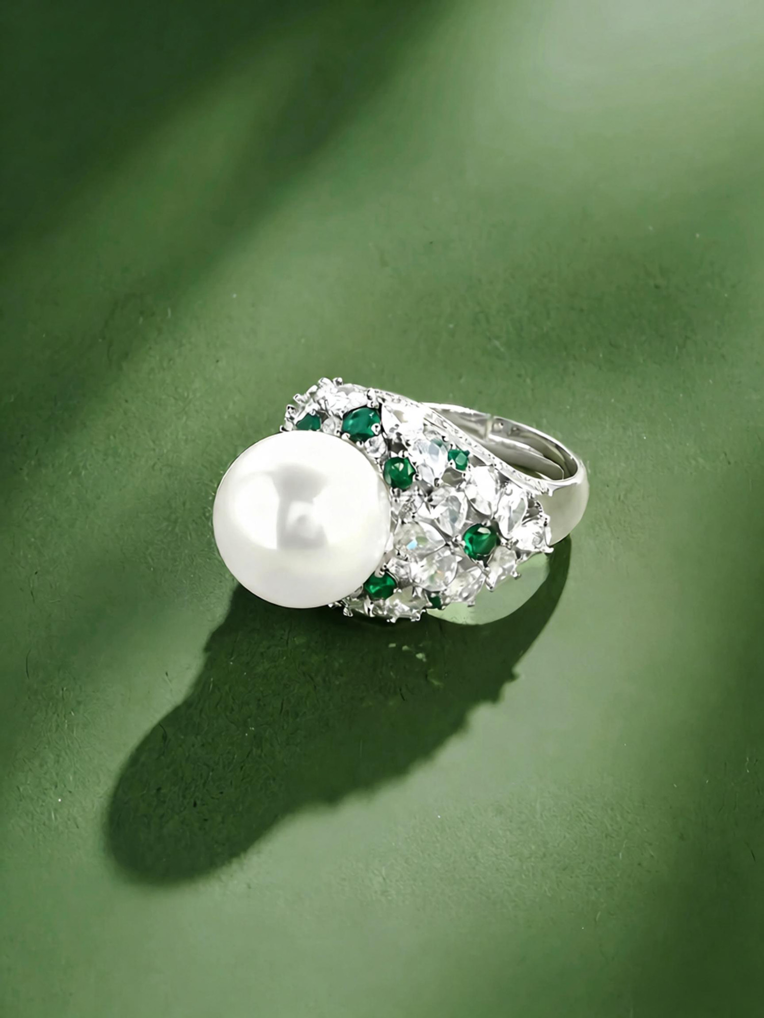 Floating pearl ring on muted green background, elegant pearl cocktail statement jewelry