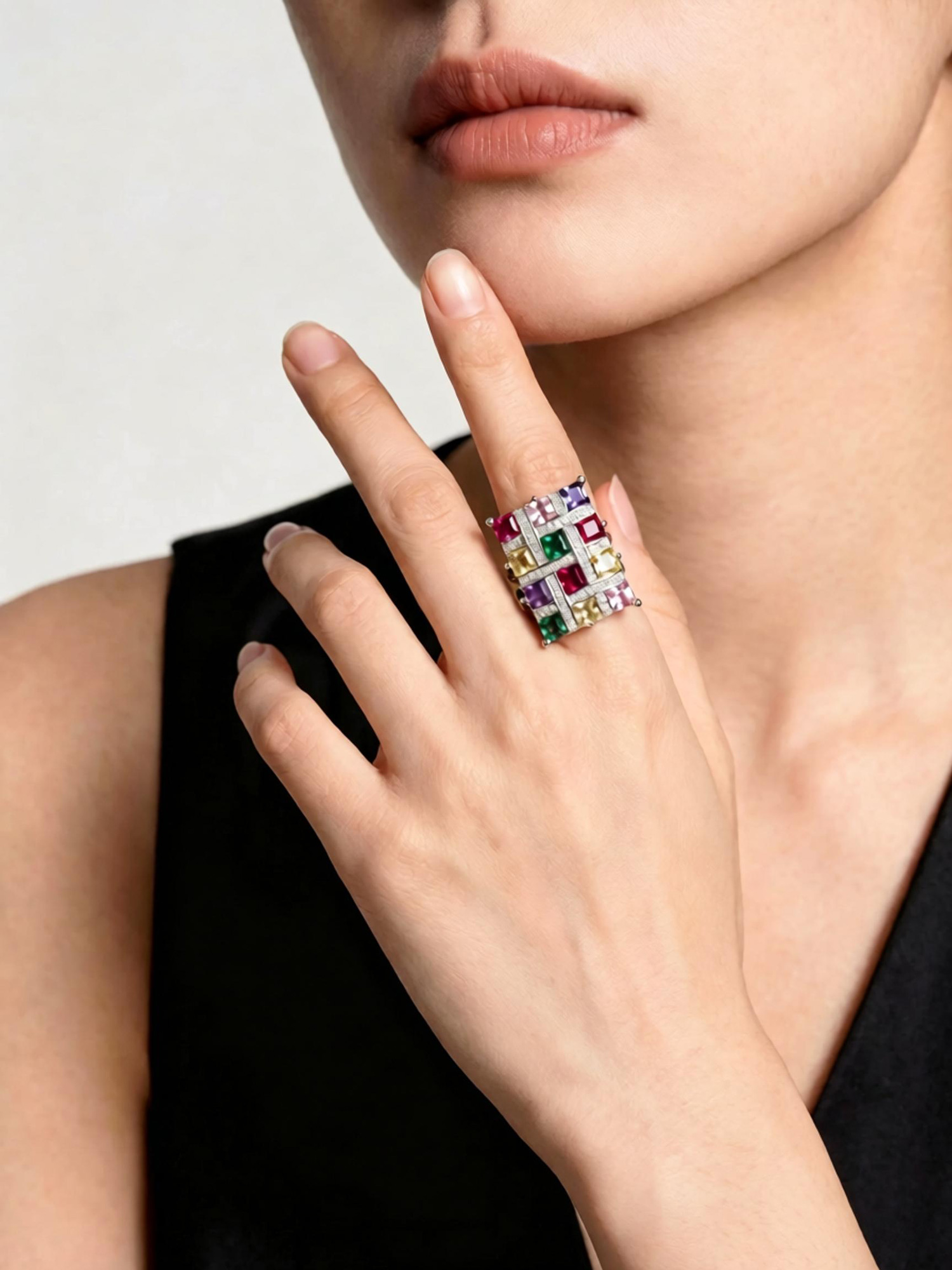 Front detail of colorful spectrum ring, geometric multicolour gemstone grid in copper platinum k‑gold plating