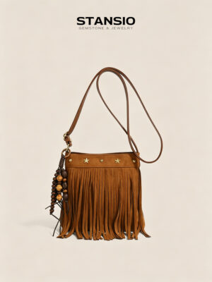 STANSIO brown boho fringe crossbody bag with star studs and wooden bead tassel on beige background
