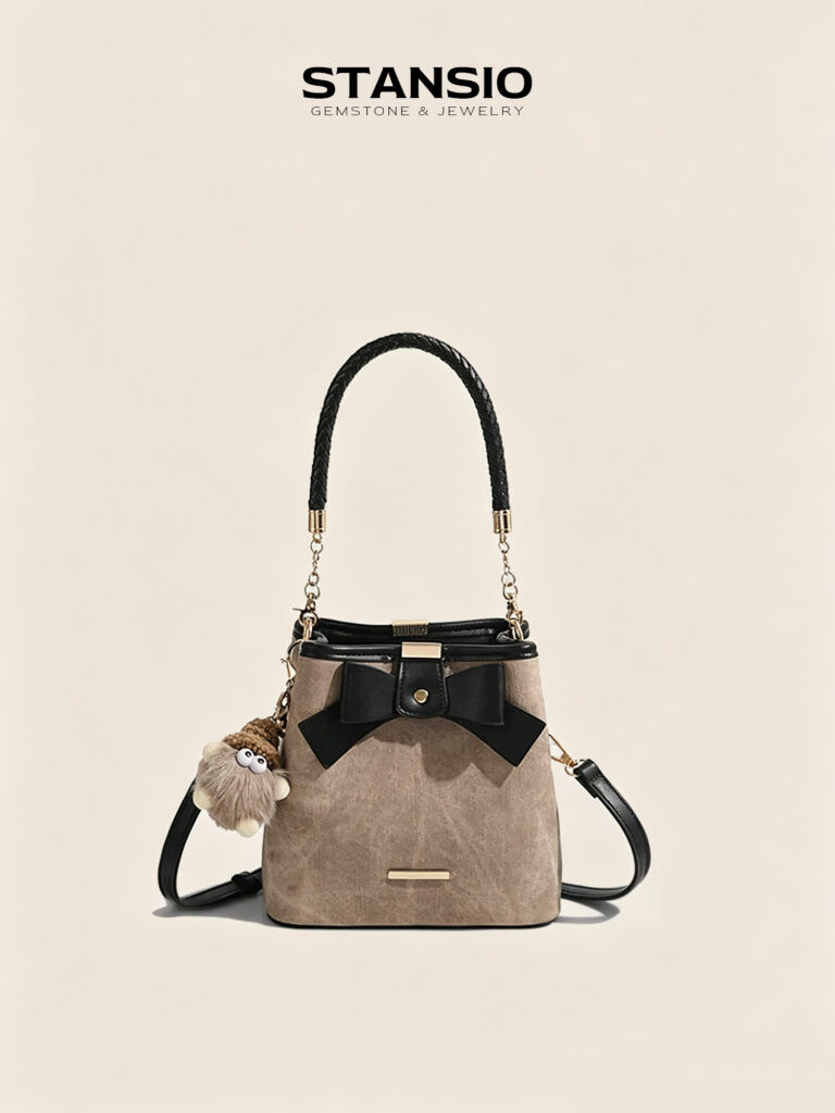 STANSIO vintage bow bucket bag with braided handle and fluffy plush charm on beige background