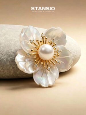 Stansio camellia pearl brooch pinned on soft white blouse, delicate floral jewelry for formal styling