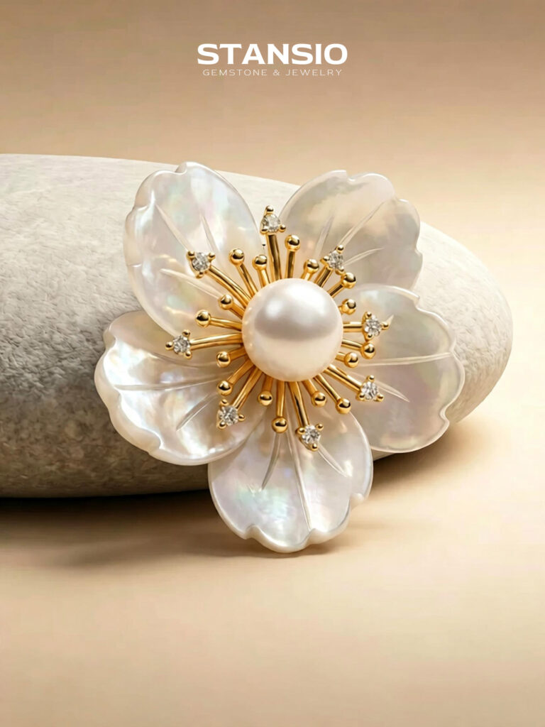 Stansio camellia pearl brooch pinned on soft white blouse, delicate floral jewelry for formal styling
