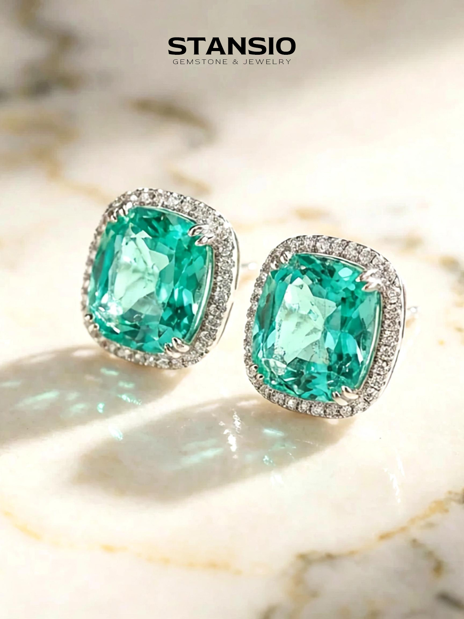 Stansio glacier emerald cushion stud earrings on vintage floral porcelain plate