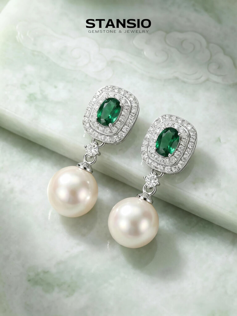 Stansio green dream pearl drop earrings on rustic wood branch background