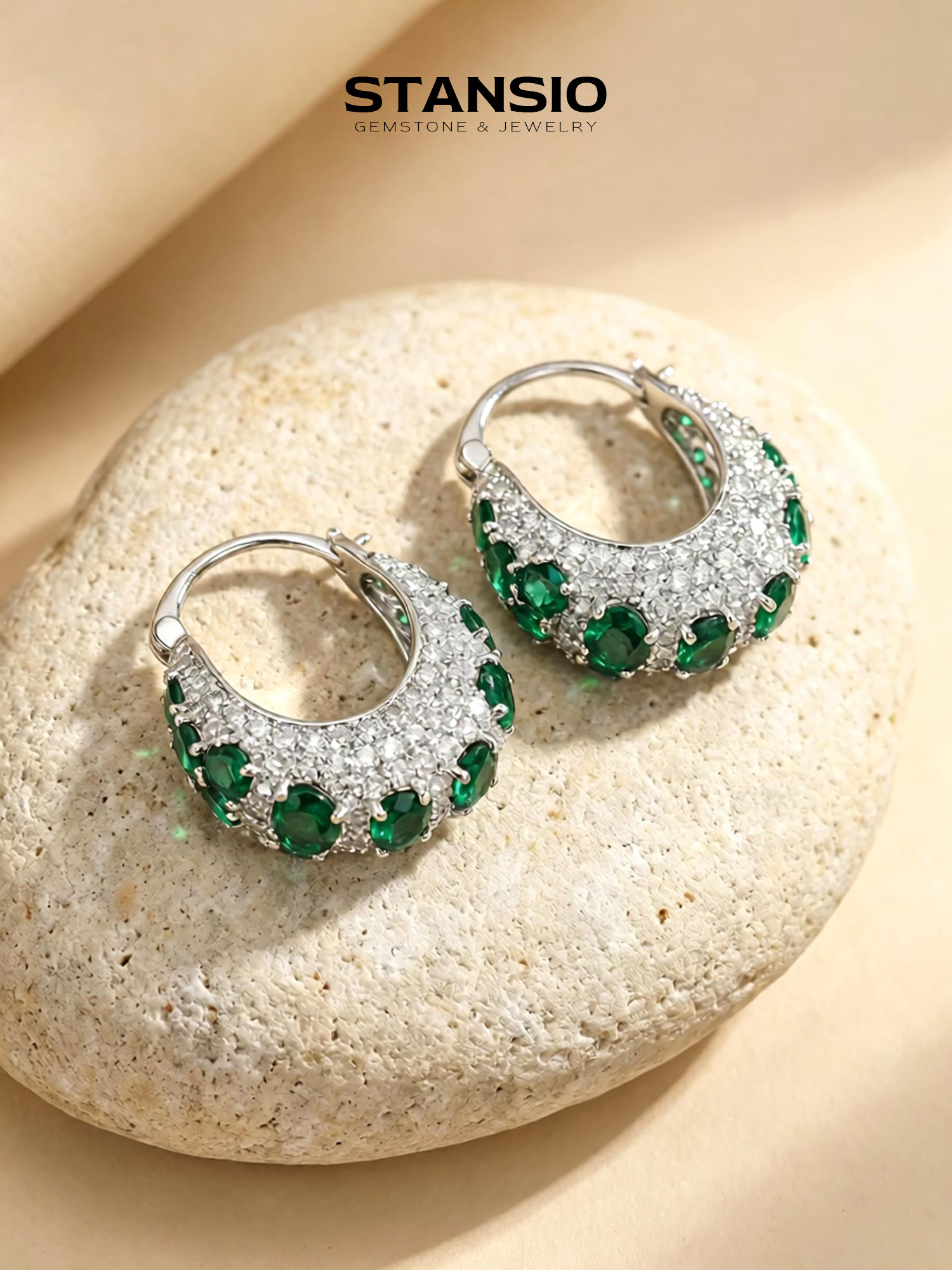 Stansio green galaxy hoop statement earrings on natural stone background