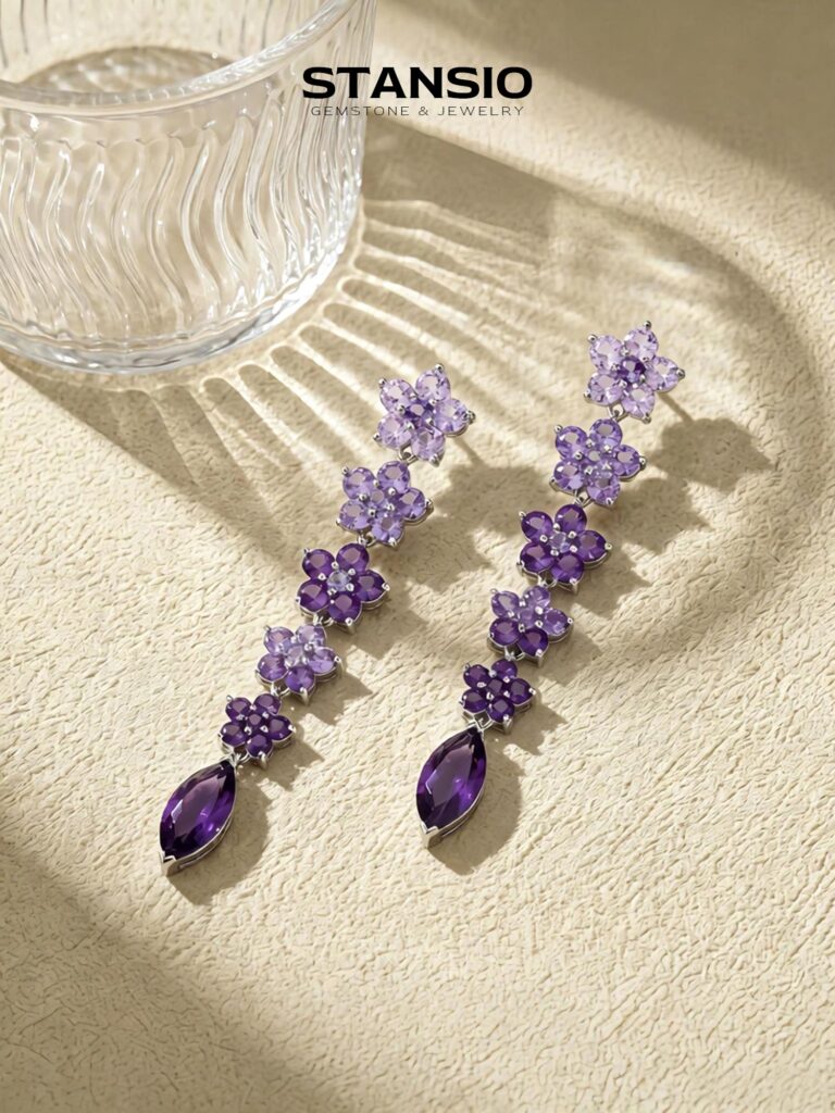 Stansio wisteria glimmer floral dangle earrings worn on model ear studio shot