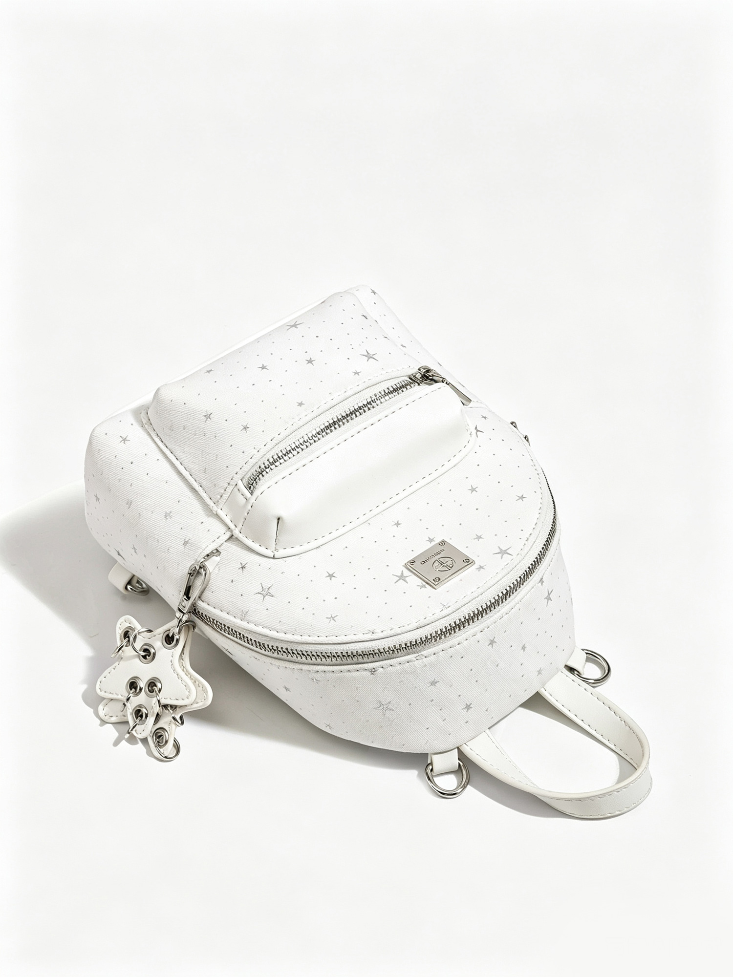 Starry white mini backpack side view, multi zipper pocket white star print backpack